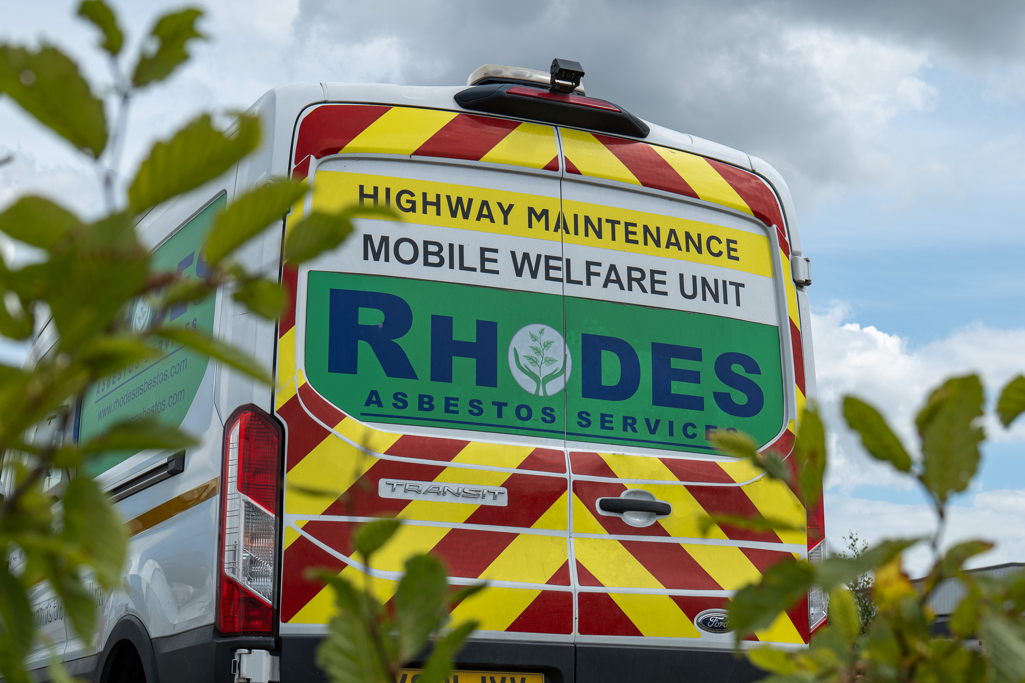 Rhodes Asbestos Services mobile welfare unit supporting safety-led asbestos work